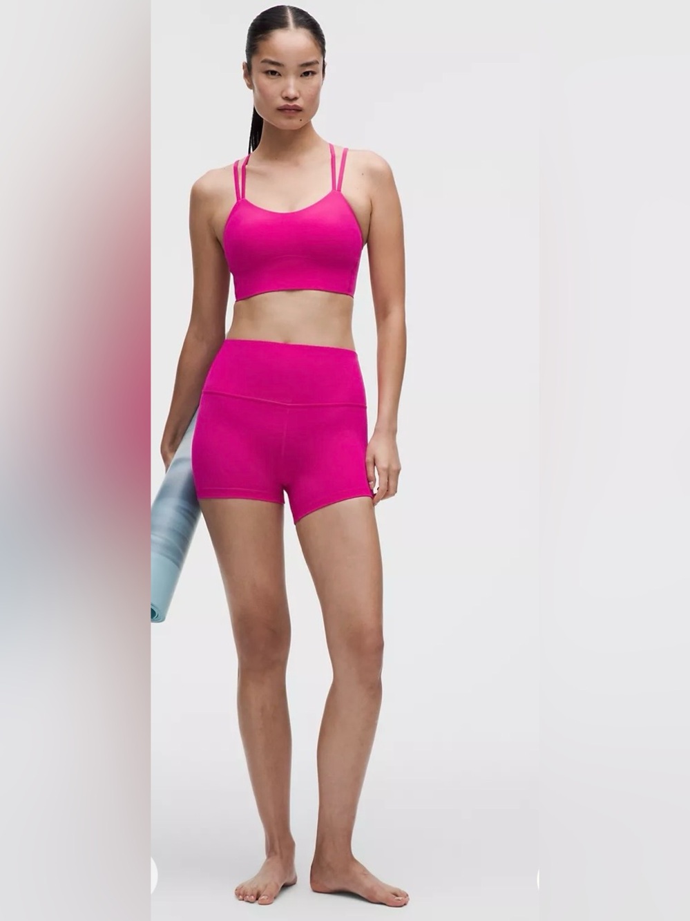 Lululemon Wunder Train High-Rise Shorts in the vibrant color Magenta Purple.